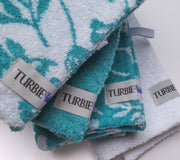 Set of 4 100% Cotton Turbie Twists in the colors White, Aqua, White with an Aqua Floral Print, and Aqua with a White Floral Print.